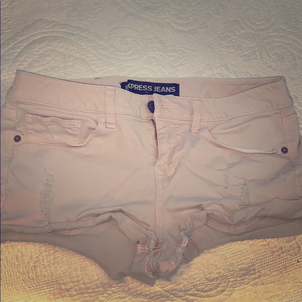 Ripped pink shorts